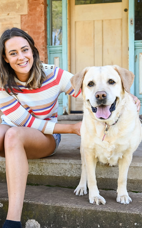 Business owner, Emma with Labrador Daisy