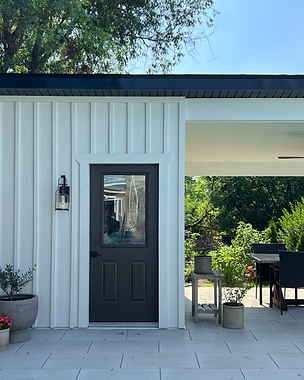 picture of a new pool shed constructed with a lean-to style roof and board and batton