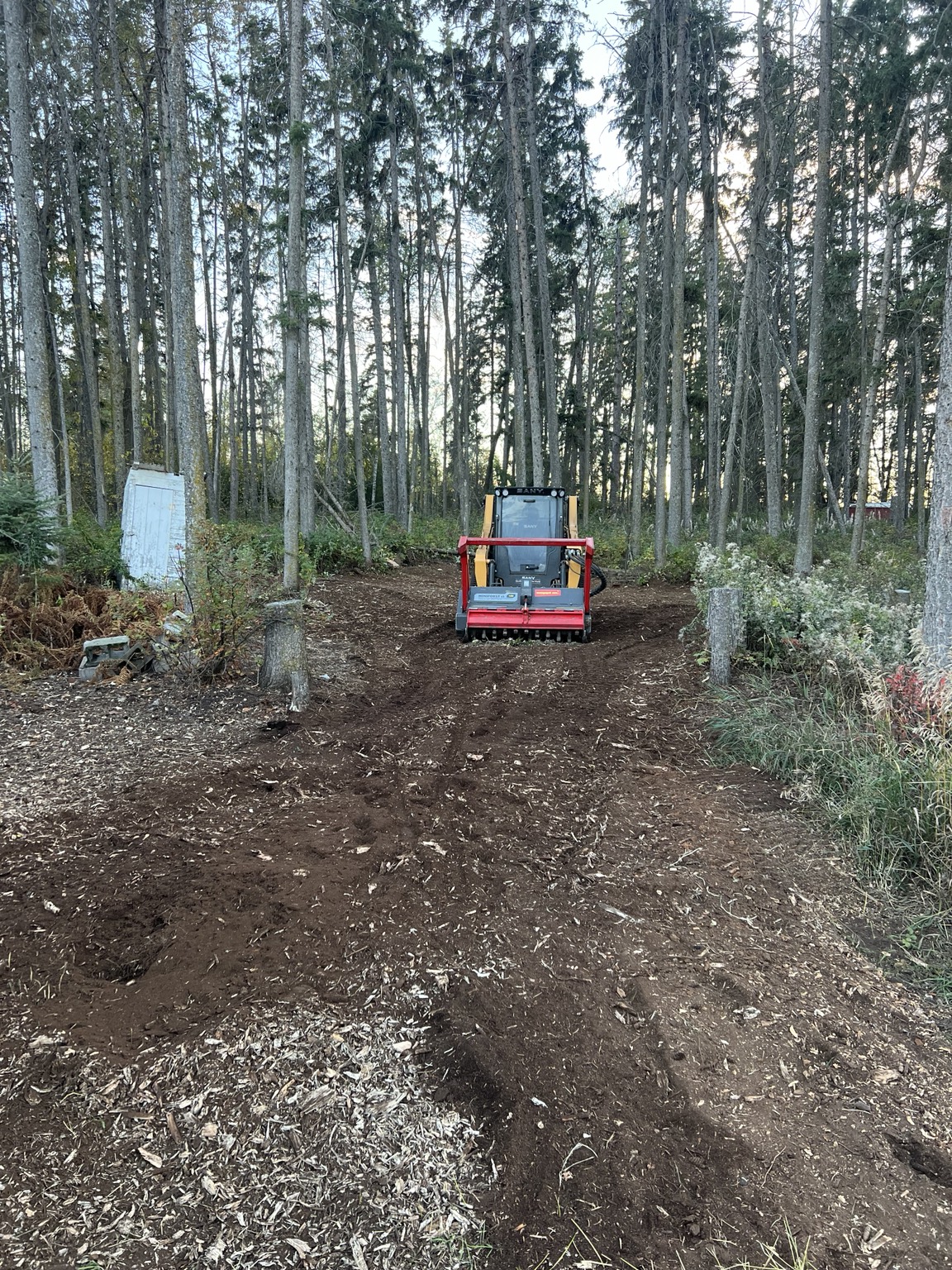 During — skid steer mulching and acreage reclamation