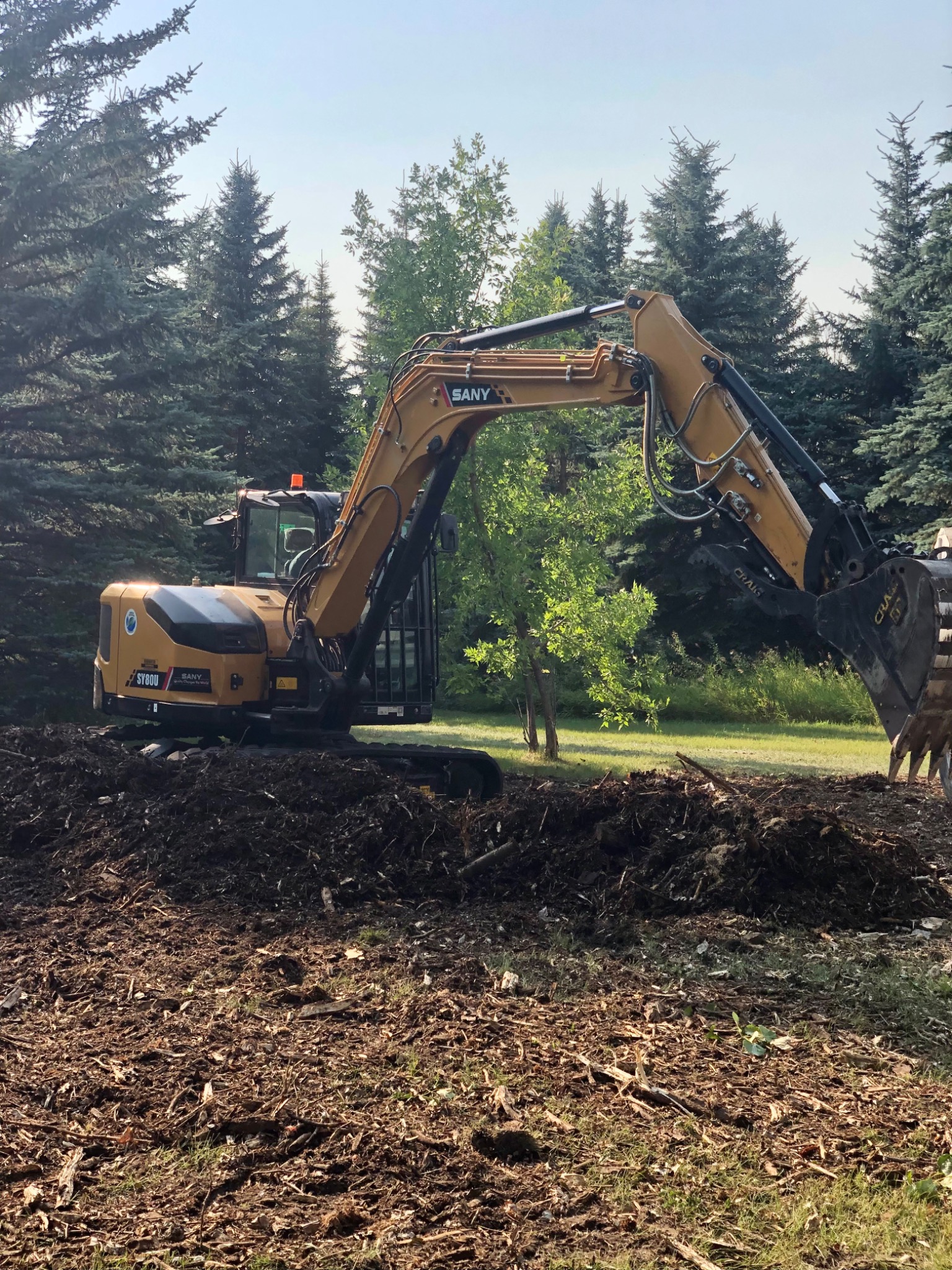Excavator working on rural property