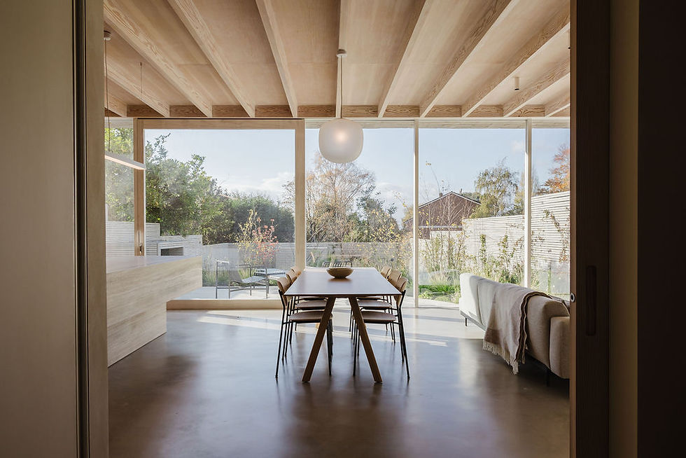Beautiful natural light highlights the Accoya doors and Douglas Fir ceiling, bringing warmth and depth to the space.