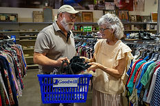 An older married couple shopping together at Goodwill
