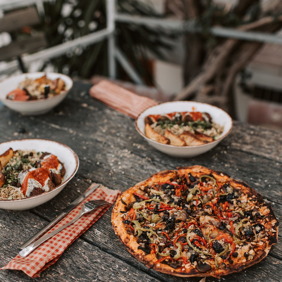pizza on a rustic wooden table