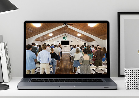 computer screen with people gathering at church service