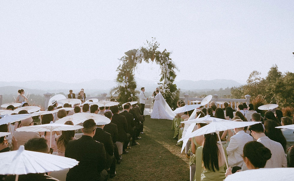 Garden wedding venue in Chiang Mai with outdoor ceremony setup and floral arch