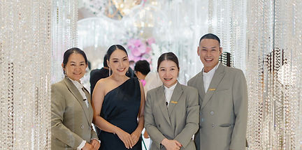 Wedding planning team coordinating engagement ceremony with timeline and script.