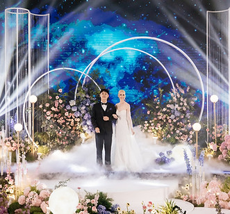 Luxury wedding stage in a hotel ballroom with LED backdrop and romantic atmosphere