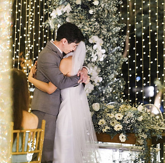 Romantic garden wedding with fairy lights glowing in the background