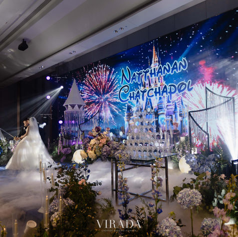 A low-fog mist rolling across the ballroom floor in front of a majestic castle-themed stage set.