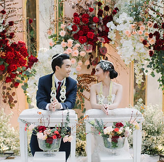 Bride and groom in Thai water pouring ceremony