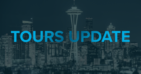 The words "Tours Update" overlaid on a Seattle skyline