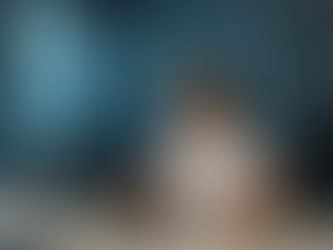 Sports Scientist in white polo at desk with laptop, writing in notebook. Lab setting with microscope. Blue scientific graphics overlay. Focused mood.