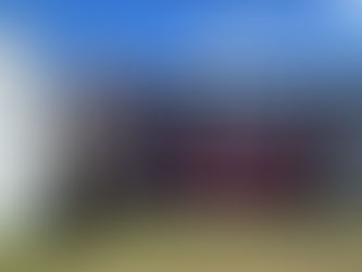 A man praying in front of a sign