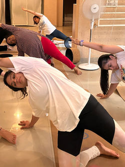 Practicing gate pose helps increase hip and spine mobility. Swadhyaya Yoga School 