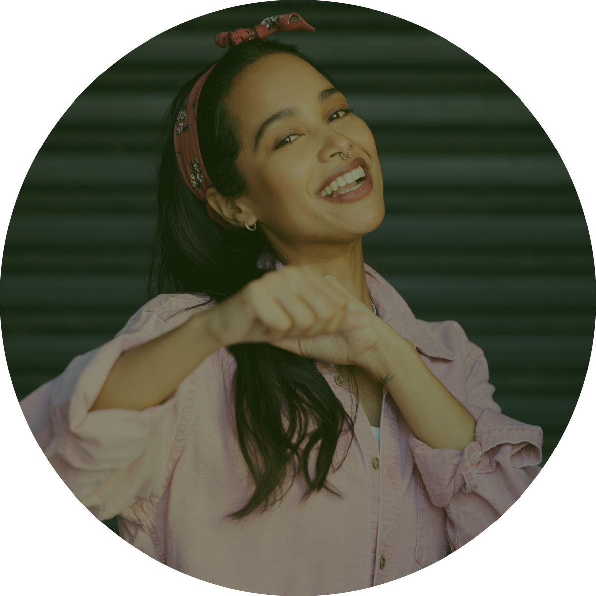 girl in pink smiling facing forward