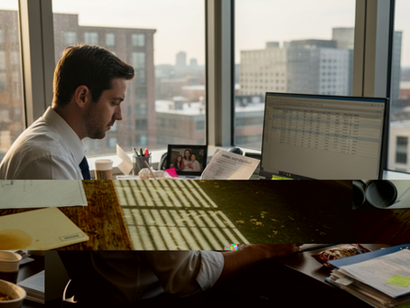 CPA reviewing compliance documents in busy office
