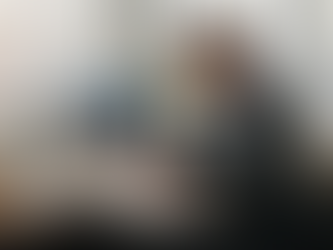 Auditor at desk reviewing internal controls checklist