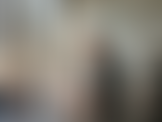 Audit committee reviewing documents in corner office