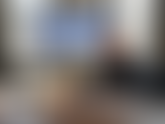 Internal auditor reviewing reports in corner office