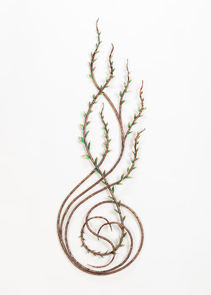 Copper sculpture of swirled vines and leaves
