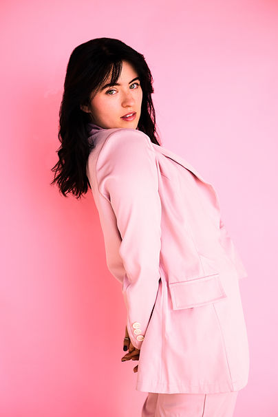 Noe Cameron posing for an editorial all in pink,
