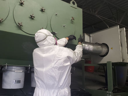Field repair tech. changing a DCU filter and inspecting the ductwork for the motor