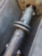 Broken shear bolts and displaced discharge screw.