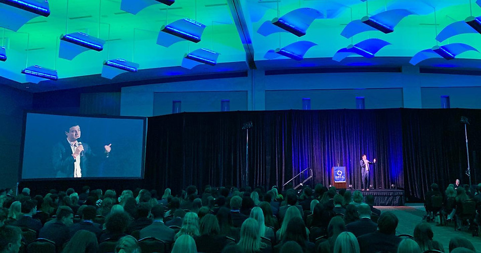 Top DECA motivational speaker, Kyle Willkom, in front of a crowd