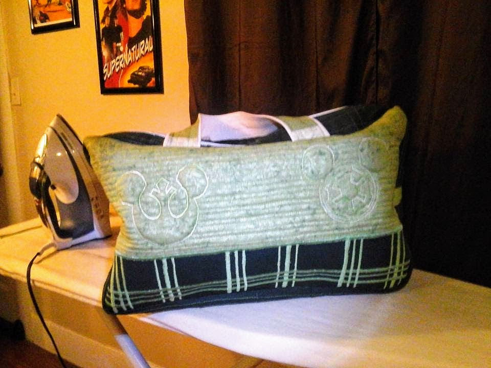 Iron and green pillow on ironing board with black stripes, A Few Costumes.