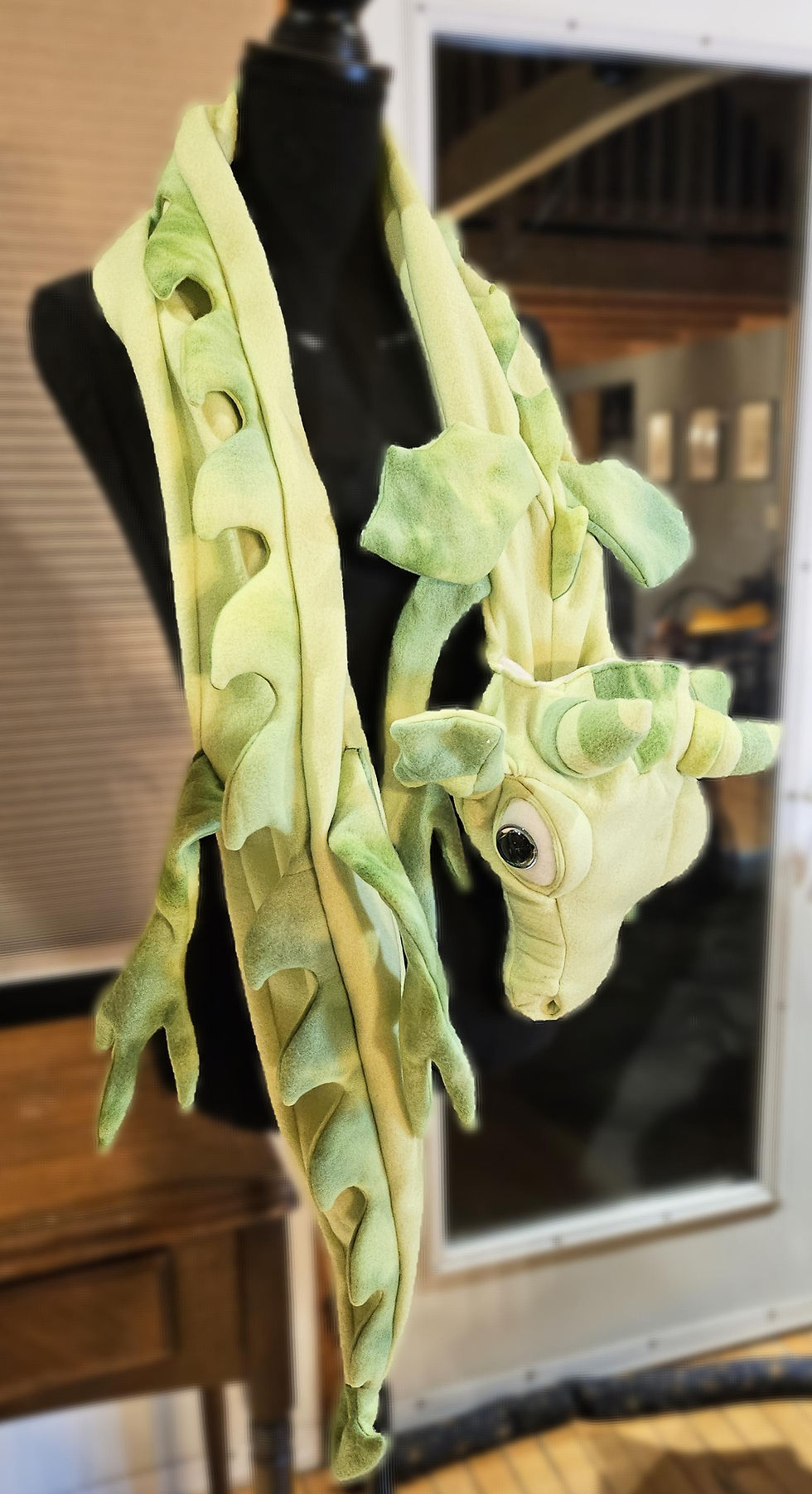 Thumbnail: Green dragon puppet scarf, a playful accessory for costume or dress up.