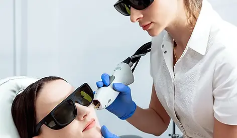 Laser melasma treatment being performed on full face at Bloom & Beam Laser Studio in Cambridge Ontario