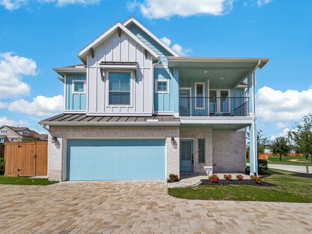 Front elevation of Chesmar home at 23939 Oriole Valley Trail in Elyson, Katy TX 77493 with covered porch