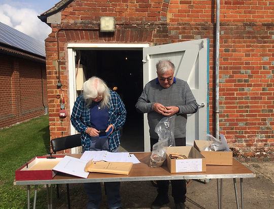 Examining excavation material at Chilcomb House