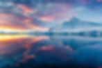Beautiful Antarctica landscape, mountains next to the sea with breathtaking reflection dur