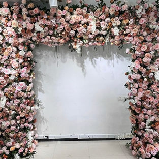 Gorgeous flower arches featuring an array of colorful blooms, creating a mesmerizing focal point for weddings, events, and celebrations.