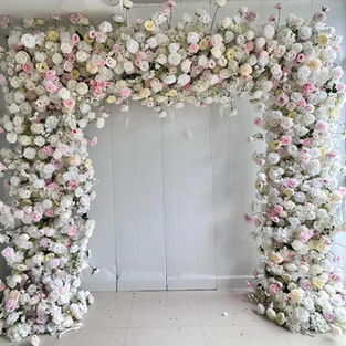 Gorgeous flower arches featuring an array of colorful blooms, creating a mesmerizing focal point for weddings, events, and celebrations.
