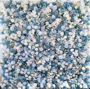 A captivating light blue mixed flower wall, featuring a delicate blend of blossoms in varying shades of blue, exuding tranquility and charm, perfect for adding a serene ambiance to your event.