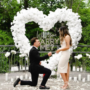 white rose heart and a will you marry me sign for a perfect proposal