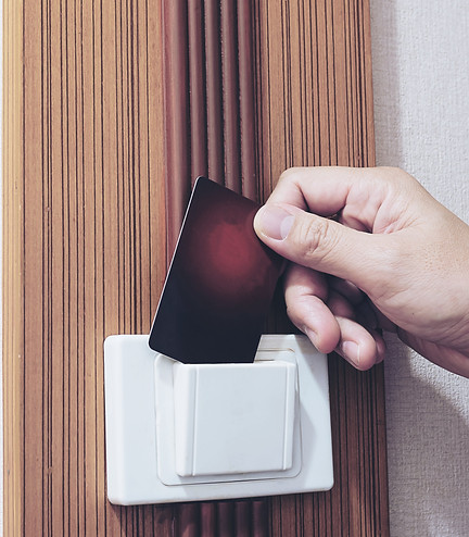 man-putting-key-card-switch-hotel-room.jpg