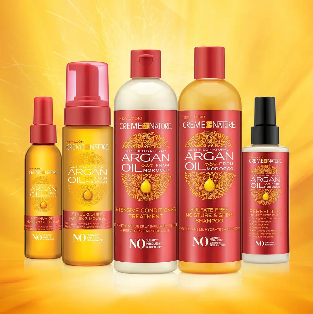 Five Crème of Nature Argan Oil hair product bottles