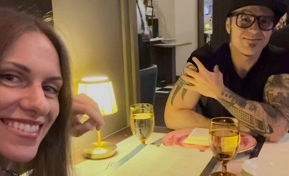 In a softly lit restaurant, Sergio and Anna from Getawayk™ sit across from each other, deeply engaged in a thoughtful discussion. They’re focused on guiding travelers with smart tips and helping them avoid common mistakes and tourist scams.