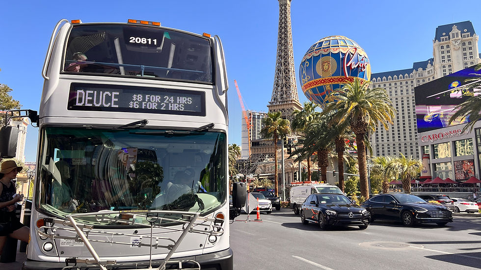 Modern Las Vegas monorail gliding past iconic casino resorts, representing a fast and economical way to get around in 2025.