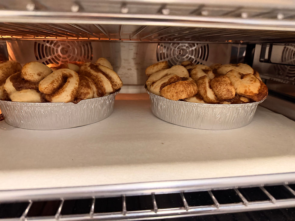 Thumbnail: Fresh cinnamon rolls baking in pans inside a farmhouse oven