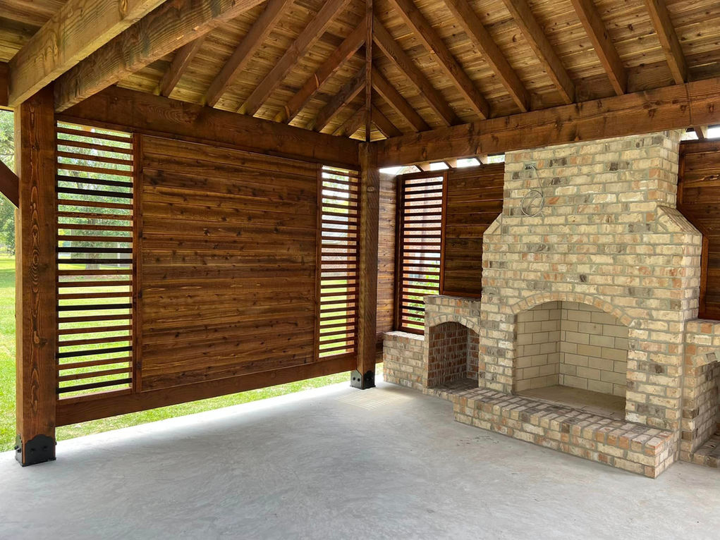 hip pavilion with custom wall and fireplace 