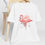 Miniatura: Artistic Pink Flamingo T-Shirt Colorful Pastel Apparel Wearable Art Beachy Tee