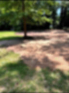 Excavator filled in a pond, grading and leveling the lot near Myrtle Beach, South Carolina