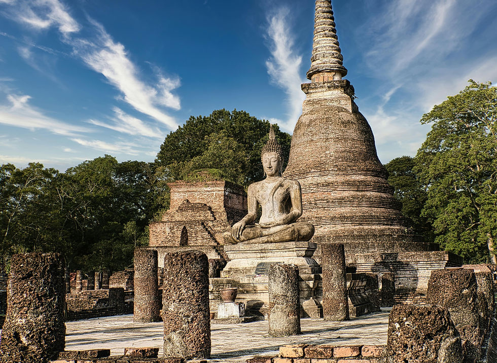 Ancient stone Buddha statue in Sukhothai Historical Park. Historic, serene atmosphere.