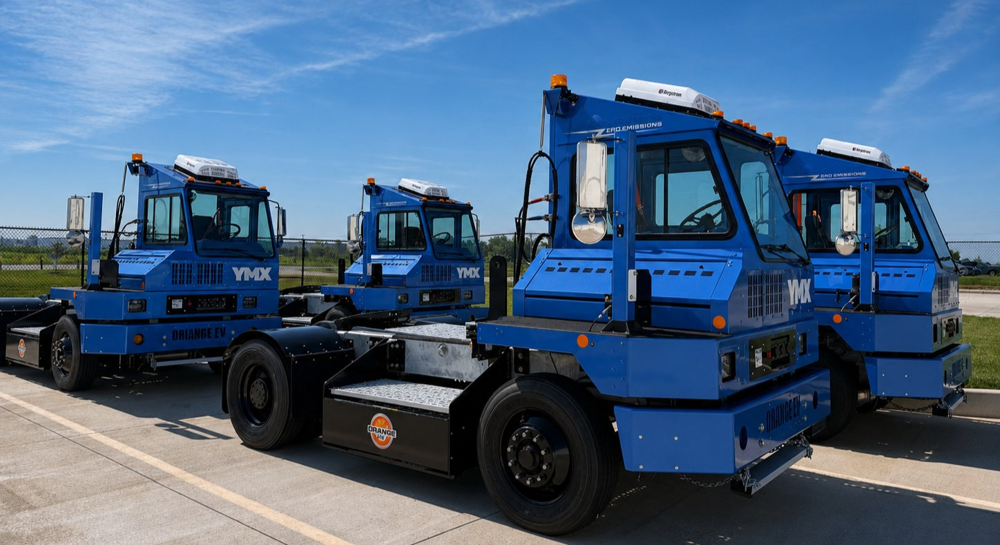 YMX Logistics' fleet of Orange EV electric yard trucks, supporting zero-emission trailer movements across customer facilities.