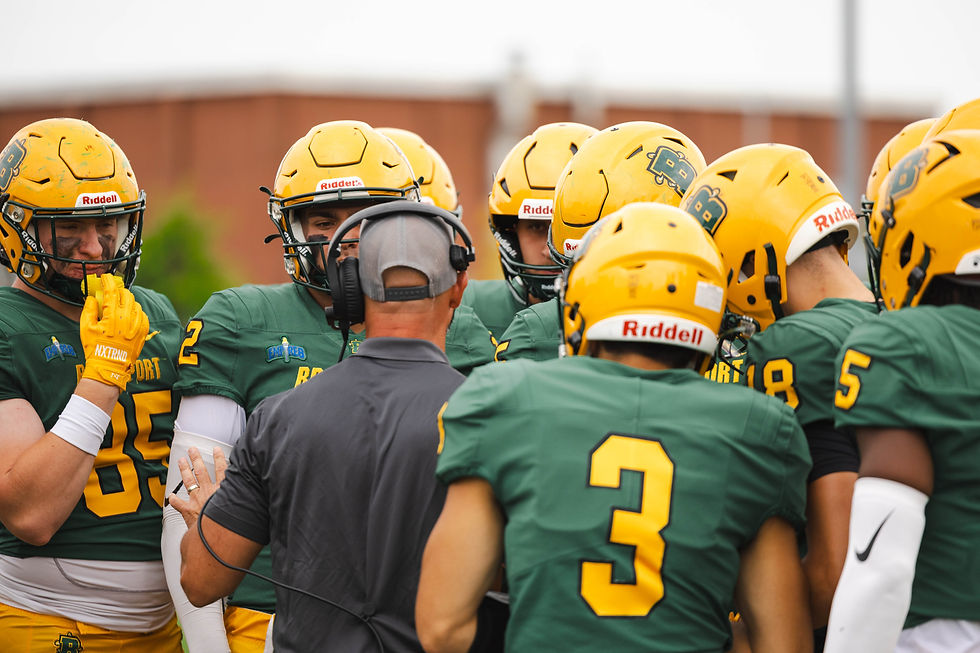 Jason Mangone and Brockport in the huddle on Sept. 13, 2025. (Photo/Brockport Athletics)