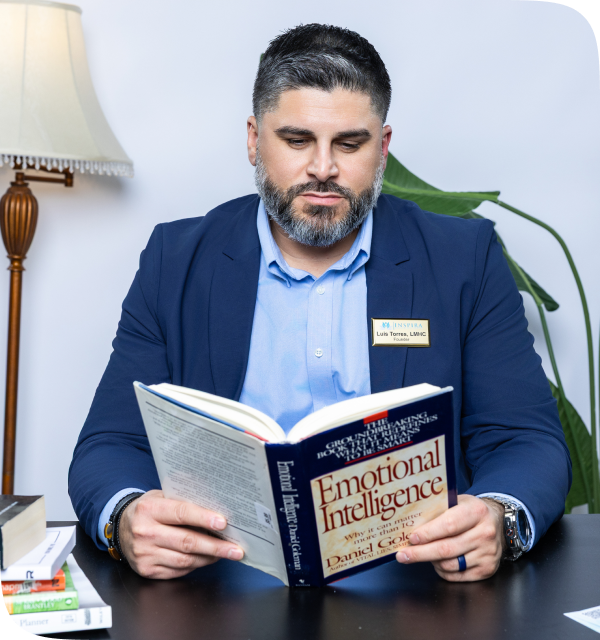 Inspira founder Luis Torres, reading a book, bilingual therapists in Western Massachusetts